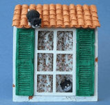 Gatitos en ventana